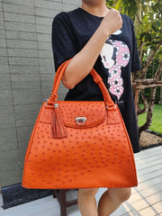 Exotisk orange handväska i äkta strutskinn
